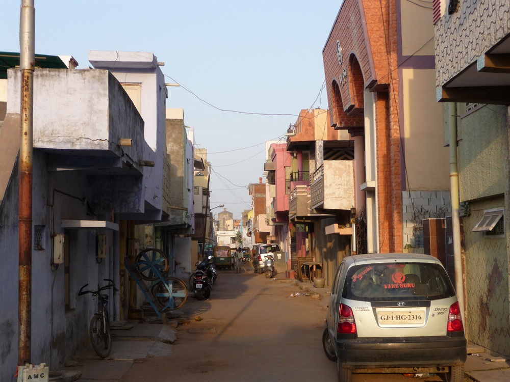 A picture containing text, building, outdoor, streetDescription automatically generated